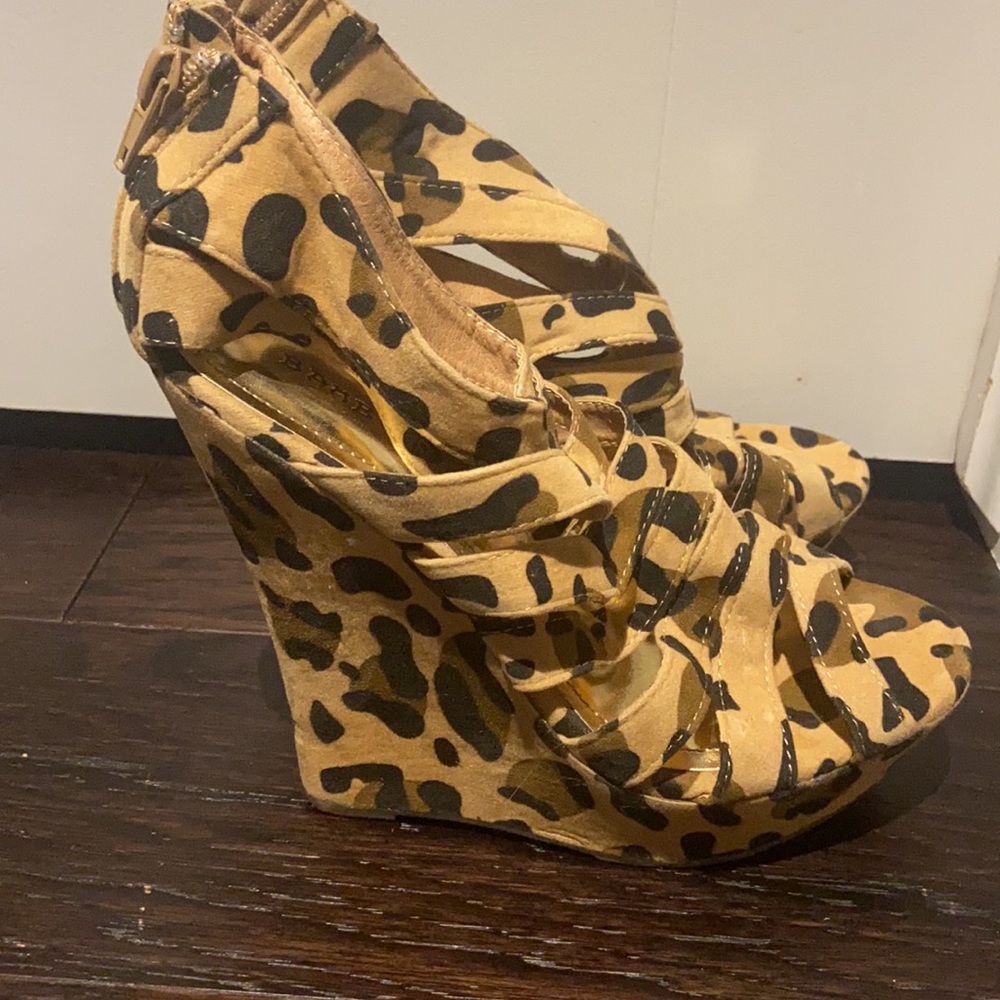 *Leopard print wedge. Back zips up. Size 6.5.*